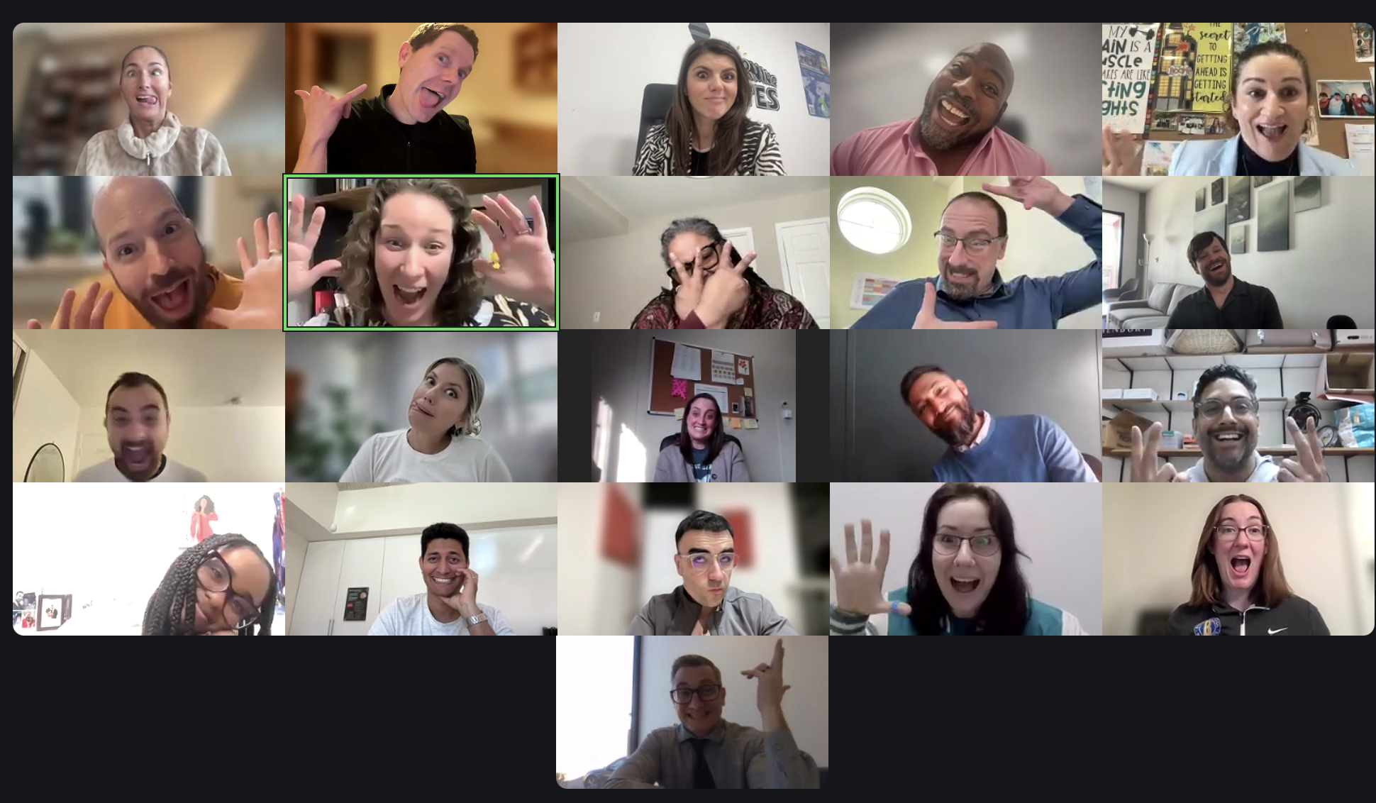 A grid of video-call windows showing GID coordinators pulling expressive faces during a training session.